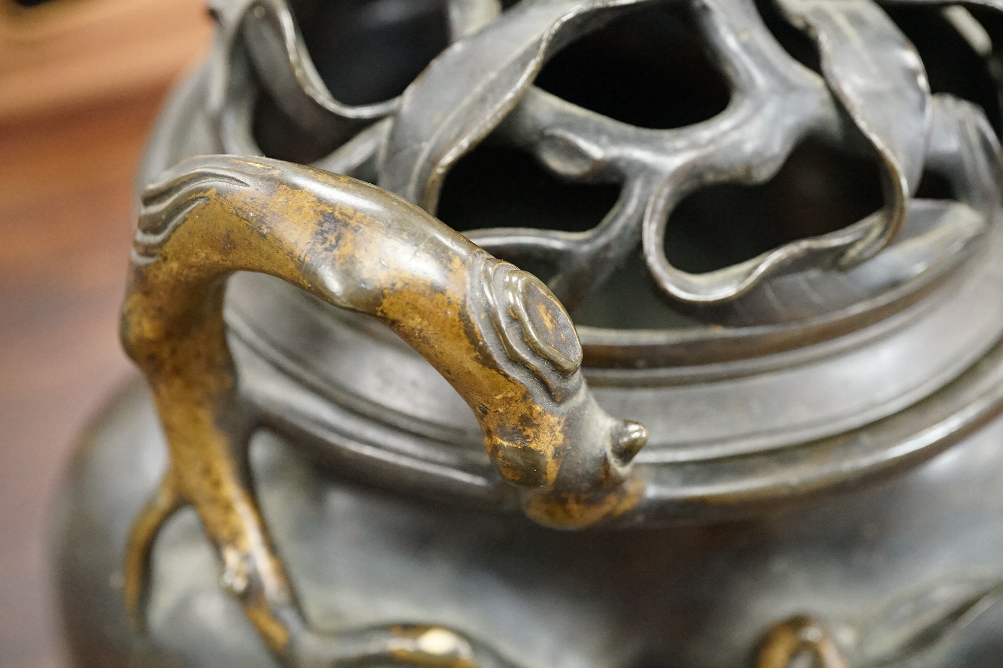 A large Chinese bronze and parcel gilt ‘peach’ censer and cover, Li, 17th/18th century